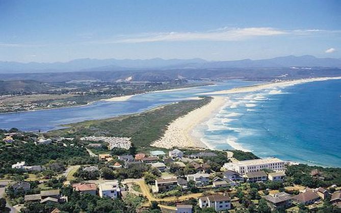 Plettenberg Bay travel scene with beach, cliffs, and coastal inspiration